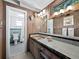 Bathroom with vintage-style vanity and shower at 1620 Casey Key Rd, Nokomis, FL 34275