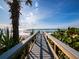 Private walkway to sandy beach, lush foliage at 1620 Casey Key Rd, Nokomis, FL 34275