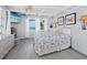 Ocean view bedroom with a king-size bed and white wicker furniture at 1620 Casey Key Rd, Nokomis, FL 34275