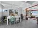 Bright dining room features a table with seating for four and views of the waterfront at 1620 Casey Key Rd, Nokomis, FL 34275