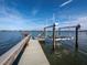 Long dock with two boat lifts and calm water view at 1620 Casey Key Rd, Nokomis, FL 34275