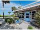 Inviting beach house entry with a light blue door and landscaped walkway at 1620 Casey Key Rd, Nokomis, FL 34275