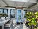 Beach house exterior with light blue door and wood siding at 1620 Casey Key Rd, Nokomis, FL 34275