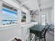 Upstairs landing with desk, chair, and water views at 1620 Casey Key Rd, Nokomis, FL 34275