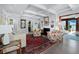 Living room boasts a fireplace, comfortable seating, and a beautiful rug at 1620 Casey Key Rd, Nokomis, FL 34275