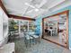 Bright sunroom with table and chairs, adjacent to the dining area at 1620 Casey Key Rd, Nokomis, FL 34275