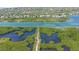 Drone view of mangrove estuary and nearby homes at 1620 Starling Dr # 204, Sarasota, FL 34231