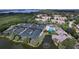 Aerial view of community with tennis courts and pool at 1620 Starling Dr # 204, Sarasota, FL 34231