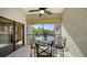 Relaxing screened balcony with a view of the trees at 1620 Starling Dr # 204, Sarasota, FL 34231