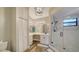 Modern bathroom with a walk-in shower and updated vanity at 1620 Starling Dr # 204, Sarasota, FL 34231