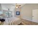 Spacious bedroom with wood-look floors and ceiling fan at 1620 Starling Dr # 204, Sarasota, FL 34231
