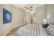 Spacious bedroom with wood-look floors and ensuite bathroom access at 1620 Starling Dr # 204, Sarasota, FL 34231