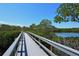 Scenic boardwalk path offering tranquil water views at 1620 Starling Dr # 204, Sarasota, FL 34231