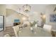Bright dining area with round table, white chairs, and natural light at 1620 Starling Dr # 204, Sarasota, FL 34231