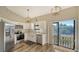 Updated kitchen featuring stainless steel appliances and white cabinets at 1620 Starling Dr # 204, Sarasota, FL 34231