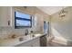 Modern kitchen with white cabinets and quartz countertops at 1620 Starling Dr # 204, Sarasota, FL 34231