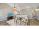 Living room with gray sectional sofa and a large TV at 1620 Starling Dr # 204, Sarasota, FL 34231