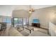 Living room with sectional sofa, balcony access, and open floor plan at 1620 Starling Dr # 204, Sarasota, FL 34231