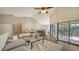 Living area with sectional sofa, coffee table, and view of kitchen at 1620 Starling Dr # 204, Sarasota, FL 34231