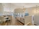 Spacious living room with vaulted ceiling, L-shaped sofa, and access to balcony at 1620 Starling Dr # 204, Sarasota, FL 34231