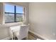 Home office with a white desk and chair, and a view from the window at 1620 Starling Dr # 204, Sarasota, FL 34231