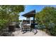 Relaxing waterfront pavilion with wooden deck and stairs at 1620 Starling Dr # 204, Sarasota, FL 34231