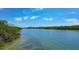 Serene waterway view with lush greenery and distant homes at 1620 Starling Dr # 204, Sarasota, FL 34231