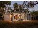 The exterior of a contemporary style home with lots of glass and a covered lanai at 1695 Lowe Dr, Sarasota, FL 34236