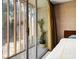 Bedroom featuring natural light and an outdoor view of the lush landscaping at 1695 Lowe Dr, Sarasota, FL 34236