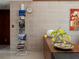 Stylish interior showcasing a built in magazine rack next to a credenza with yellow flowers at 1695 Lowe Dr, Sarasota, FL 34236