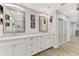 Double vanity bathroom with marble countertop and modern fixtures at 1819 Bridge St, Englewood, FL 34223