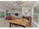 Dining area with wood table and chairs, open to living room at 1819 Bridge St, Englewood, FL 34223