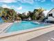 Relaxing community pool with plenty of lounge chairs at 1918 Harbourside Dr # 902, Longboat Key, FL 34228