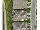 Aerial view of houses with grey roofs and paved driveways at 192 Van Gogh Cv, Bradenton, FL 34212
