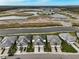 Aerial view of waterfront homes with grey roofs and lush landscaping at 192 Van Gogh Cv, Bradenton, FL 34212