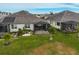 Backyard with covered patio, spa, and lush landscaping at 192 Van Gogh Cv, Bradenton, FL 34212