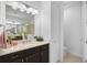 Bathroom with dark vanity, marble countertop, and walk-in shower at 192 Van Gogh Cv, Bradenton, FL 34212