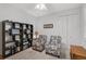 Bedroom with two armchairs and a large display of model cars at 192 Van Gogh Cv, Bradenton, FL 34212