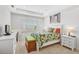 Cozy bedroom with a leafy comforter and white dresser at 192 Van Gogh Cv, Bradenton, FL 34212
