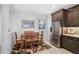 Small dining area with wood table and chairs near kitchen at 192 Van Gogh Cv, Bradenton, FL 34212