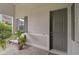 Front entry with dark gray door, tiled flooring, and plants at 192 Van Gogh Cv, Bradenton, FL 34212