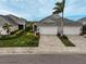 Two-car garage home with landscaped yard and paver driveway at 192 Van Gogh Cv, Bradenton, FL 34212