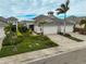 Two-car garage home with landscaped yard and paver driveway at 192 Van Gogh Cv, Bradenton, FL 34212