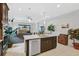Modern kitchen island with stainless steel appliances and view to backyard at 192 Van Gogh Cv, Bradenton, FL 34212