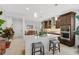 Island kitchen with white quartz countertops and stainless steel appliances at 192 Van Gogh Cv, Bradenton, FL 34212
