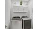 Laundry room with Samsung washer and dryer, and white cabinets at 192 Van Gogh Cv, Bradenton, FL 34212