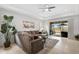 Comfortable living room with sectional sofa and sliding doors to patio at 192 Van Gogh Cv, Bradenton, FL 34212