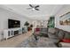 Bright living room featuring a sectional sofa and fireplace at 192 Van Gogh Cv, Bradenton, FL 34212