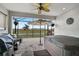 Outdoor patio with hot tub, grill, and screened enclosure at 192 Van Gogh Cv, Bradenton, FL 34212