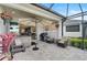 Relaxing patio with hot tub, outdoor seating, and screened lanai at 192 Van Gogh Cv, Bradenton, FL 34212